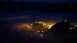 Preview wallpaper city, night, fog, light, mountains, rimini, italy