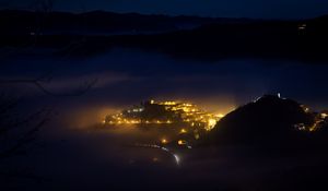 Preview wallpaper city, night, fog, light, mountains, rimini, italy