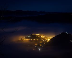 Preview wallpaper city, night, fog, light, mountains, rimini, italy