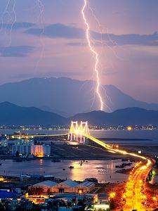 Preview wallpaper city, night, lights, mountains, lightning