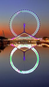 Preview wallpaper city, night, lights, wheel, house, river, reflection