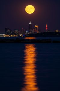 Preview wallpaper city, night, moon, buildings, water, reflection