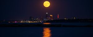 Preview wallpaper city, night, moon, buildings, water, reflection