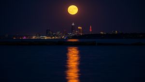 Preview wallpaper city, night, moon, buildings, water, reflection
