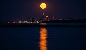 Preview wallpaper city, night, moon, buildings, water, reflection