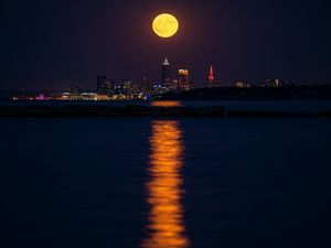 Preview wallpaper city, night, moon, buildings, water, reflection