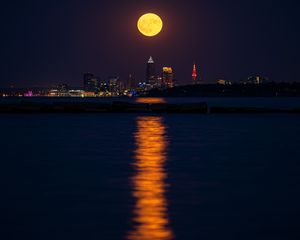 Preview wallpaper city, night, moon, buildings, water, reflection