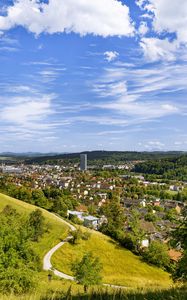 Preview wallpaper city, panorama, hills, trees, forest, sky, clouds