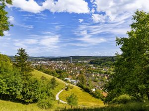 Preview wallpaper city, panorama, hills, trees, forest, sky, clouds