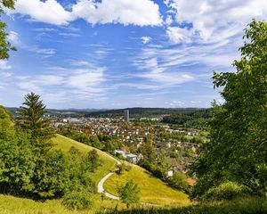 Preview wallpaper city, panorama, hills, trees, forest, sky, clouds