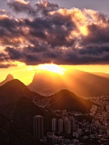 Preview wallpaper city, peaks, sunset, sun