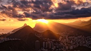 Preview wallpaper city, peaks, sunset, sun