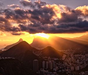 Preview wallpaper city, peaks, sunset, sun