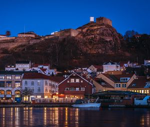 Preview wallpaper city, pier, rocks, evening, lights