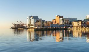 Preview wallpaper city, pier, water, reflection, buildings