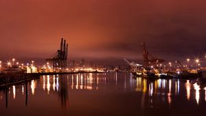 Preview wallpaper city, port, cranes, lights, light, reflection