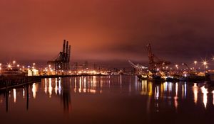 Preview wallpaper city, port, cranes, lights, light, reflection