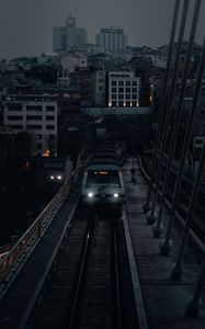 Preview wallpaper city, railroad, train, buildings, twilight