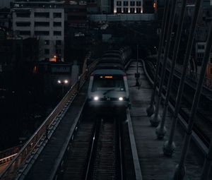 Preview wallpaper city, railroad, train, buildings, twilight