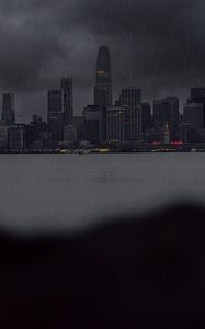 Preview wallpaper city, rain, buildings, river, coast