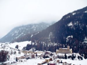 Preview wallpaper city, resort, mountains, alps, snow, winter, tilt-shift