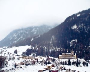 Preview wallpaper city, resort, mountains, alps, snow, winter, tilt-shift