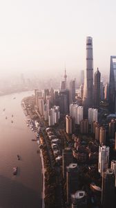 Preview wallpaper city, river, aerial view, buildings, fog, metropolis