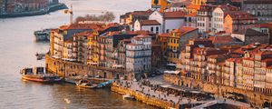 Preview wallpaper city, river, boats, buildings, aerial view