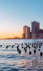 Preview wallpaper city, river, buildings, sun
