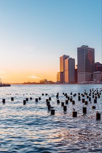Preview wallpaper city, river, buildings, sun
