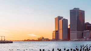Preview wallpaper city, river, buildings, sun