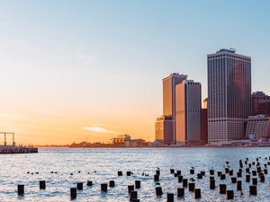 Preview wallpaper city, river, buildings, sun
