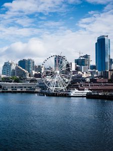 Preview wallpaper city, river, coast, buildings, ferris wheel, view