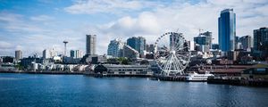 Preview wallpaper city, river, coast, buildings, ferris wheel, view