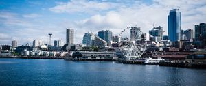 Preview wallpaper city, river, coast, buildings, ferris wheel, view