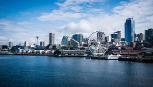 Preview wallpaper city, river, coast, buildings, ferris wheel, view