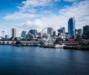 Preview wallpaper city, river, coast, buildings, ferris wheel, view