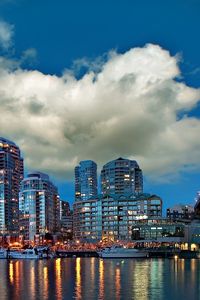 Preview wallpaper city, river, sea, water, clouds, sky, building, bridge, reflection