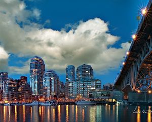 Preview wallpaper city, river, sea, water, clouds, sky, building, bridge, reflection