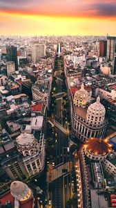 Preview wallpaper city, road, architecture, buildings, sunset