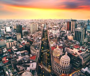 Preview wallpaper city, road, architecture, buildings, sunset