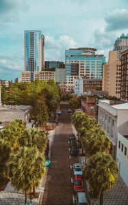 Preview wallpaper city, road, buildings, palm trees, cars