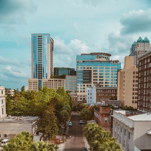 Preview wallpaper city, road, buildings, palm trees, cars