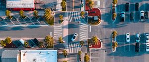 Preview wallpaper city, road, buildings, palm, aerial view