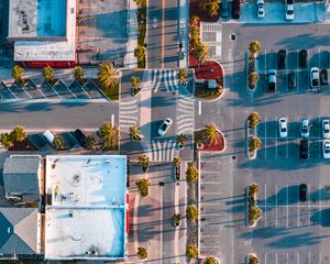 Preview wallpaper city, road, buildings, palm, aerial view