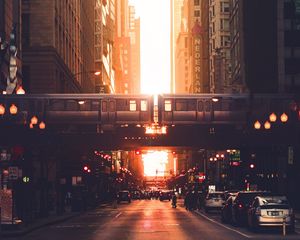 Preview wallpaper city, road, buildings, train, street, sunset