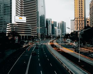 Preview wallpaper city, road, cars, buildings, skyscrapers, markings