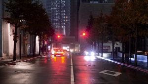 Preview wallpaper city, road, cars, light, twilight, dark