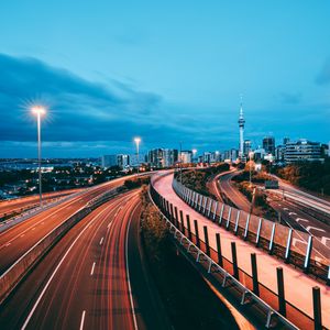 Preview wallpaper city, road, lights, long exposure, buildings, dusk