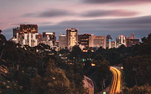 Preview wallpaper city, road, long exposure, lines, glow, trees